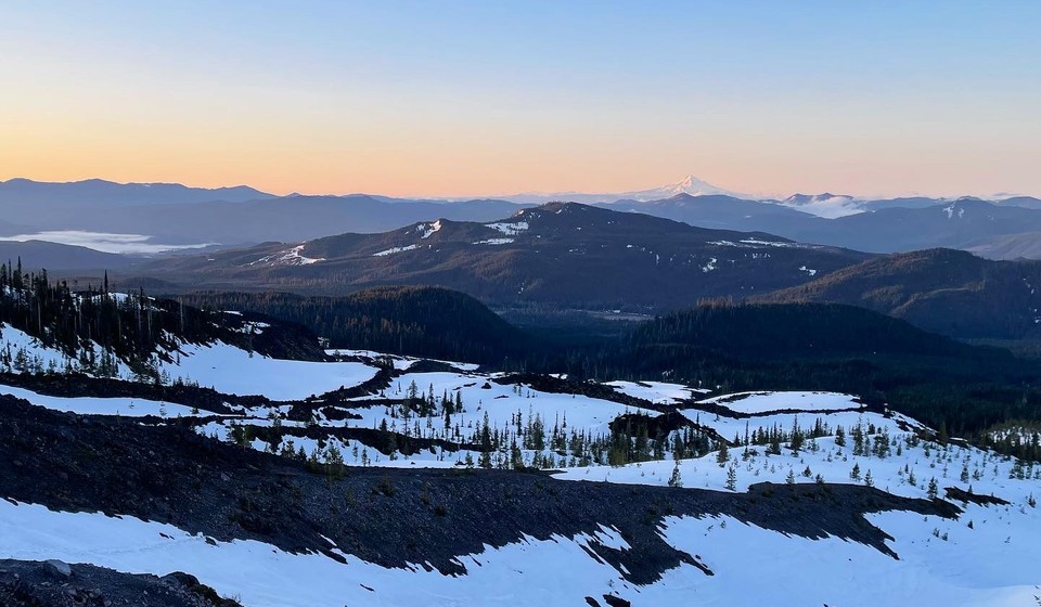 Sunrise on Mt St. Helens with Mt. Hood visible at a distance