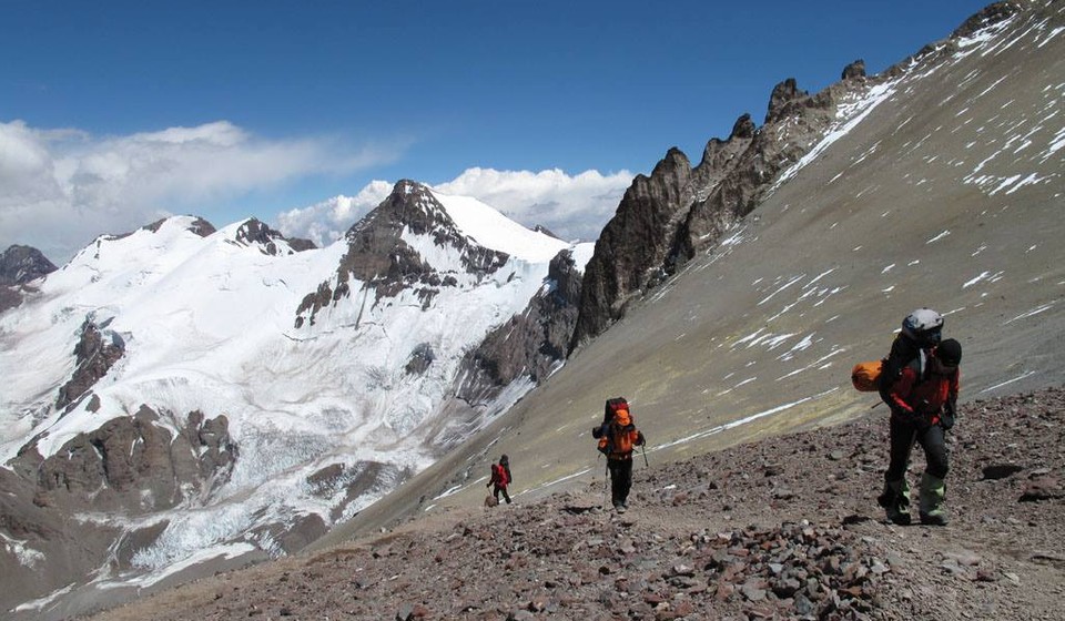 Climbers going up a steep slope on the way up to the summit of Aconcagua