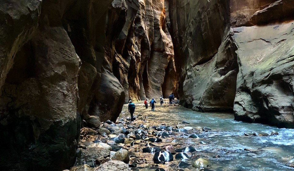 people hike the narrows in zion national park