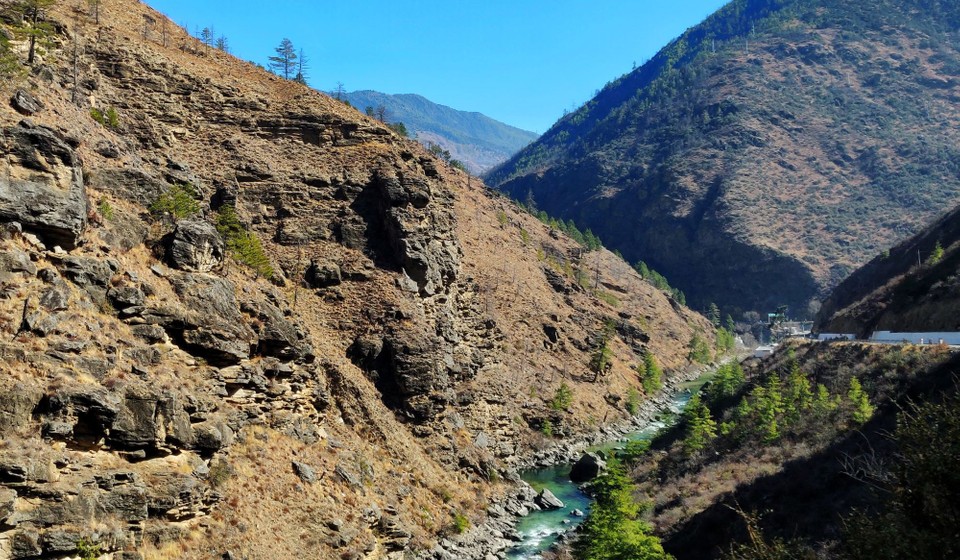 Clear water river between the hills in Paro, Bhutan